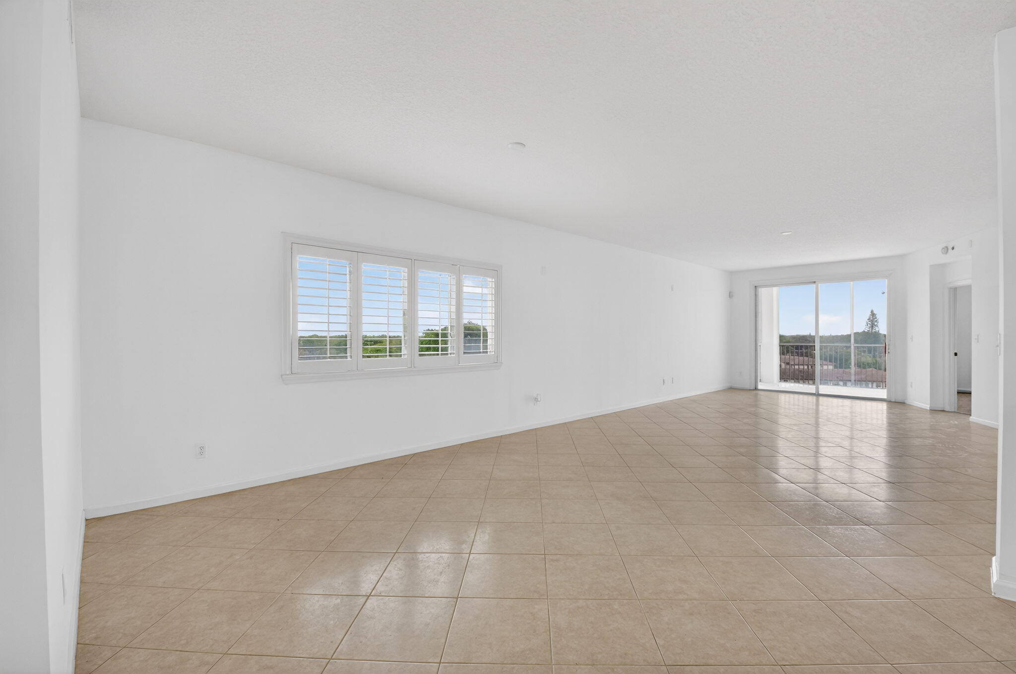 22715 Camino Del Mar, Unit 61 Boca Raton, FL 33433 - Photo 17 of 39 an empty room with windows