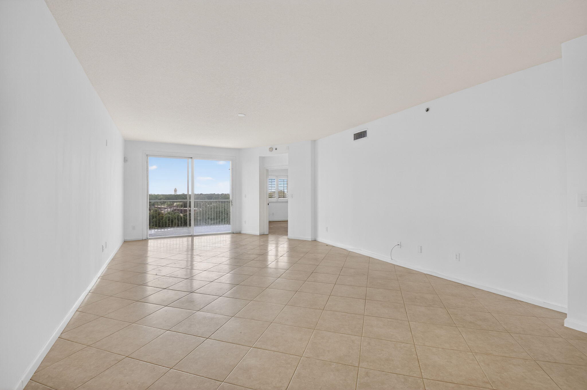 22715 Camino Del Mar, Unit 61 Boca Raton, FL 33433 - Photo 20 of 39 a view of an empty room with a fireplace