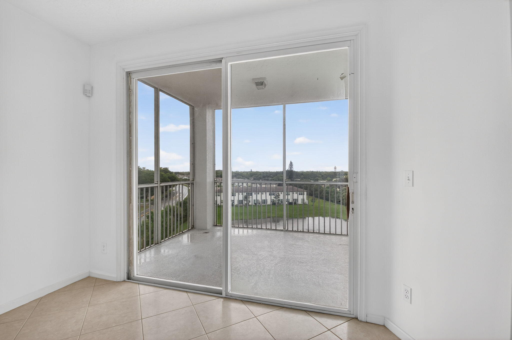 22715 Camino Del Mar, Unit 61 Boca Raton, FL 33433 - Photo 21 of 39 a view of a room that has a large window
