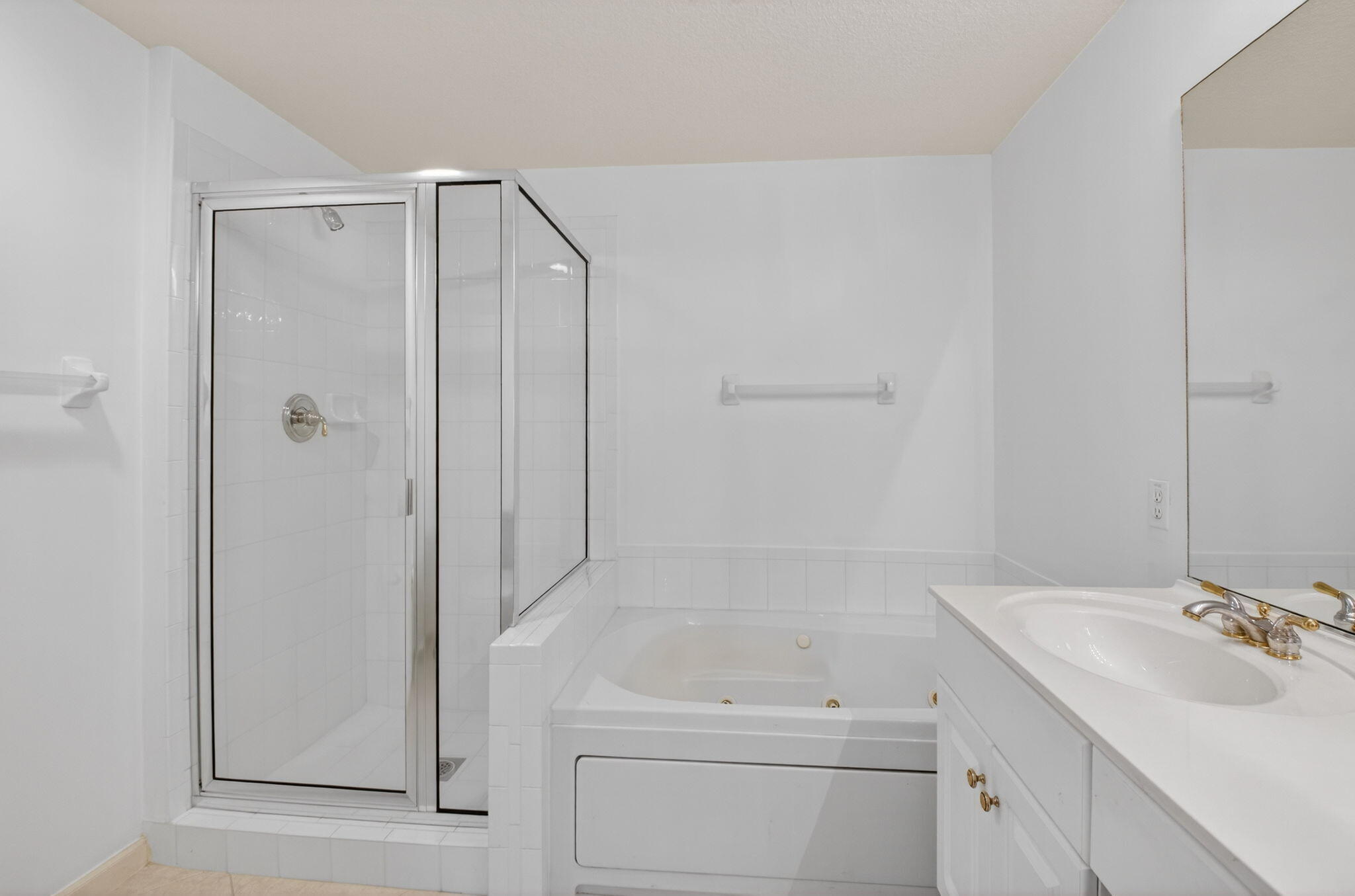 22715 Camino Del Mar, Unit 61 Boca Raton, FL 33433 - Photo 33 of 39 a bathroom with a sink and a shower