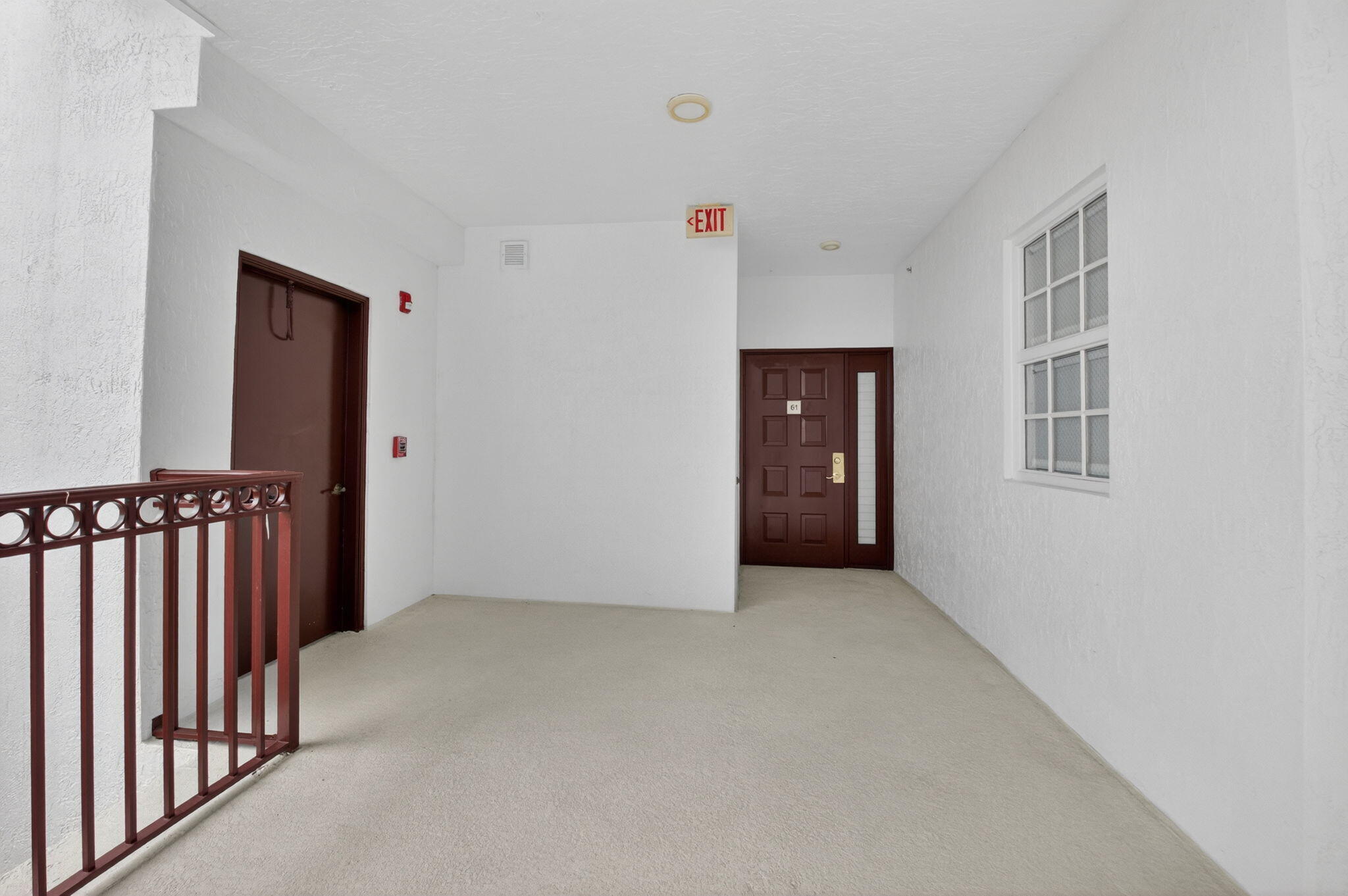 22715 Camino Del Mar, Unit 61 Boca Raton, FL 33433 - Photo 8 of 39 a view of an empty room with stairs