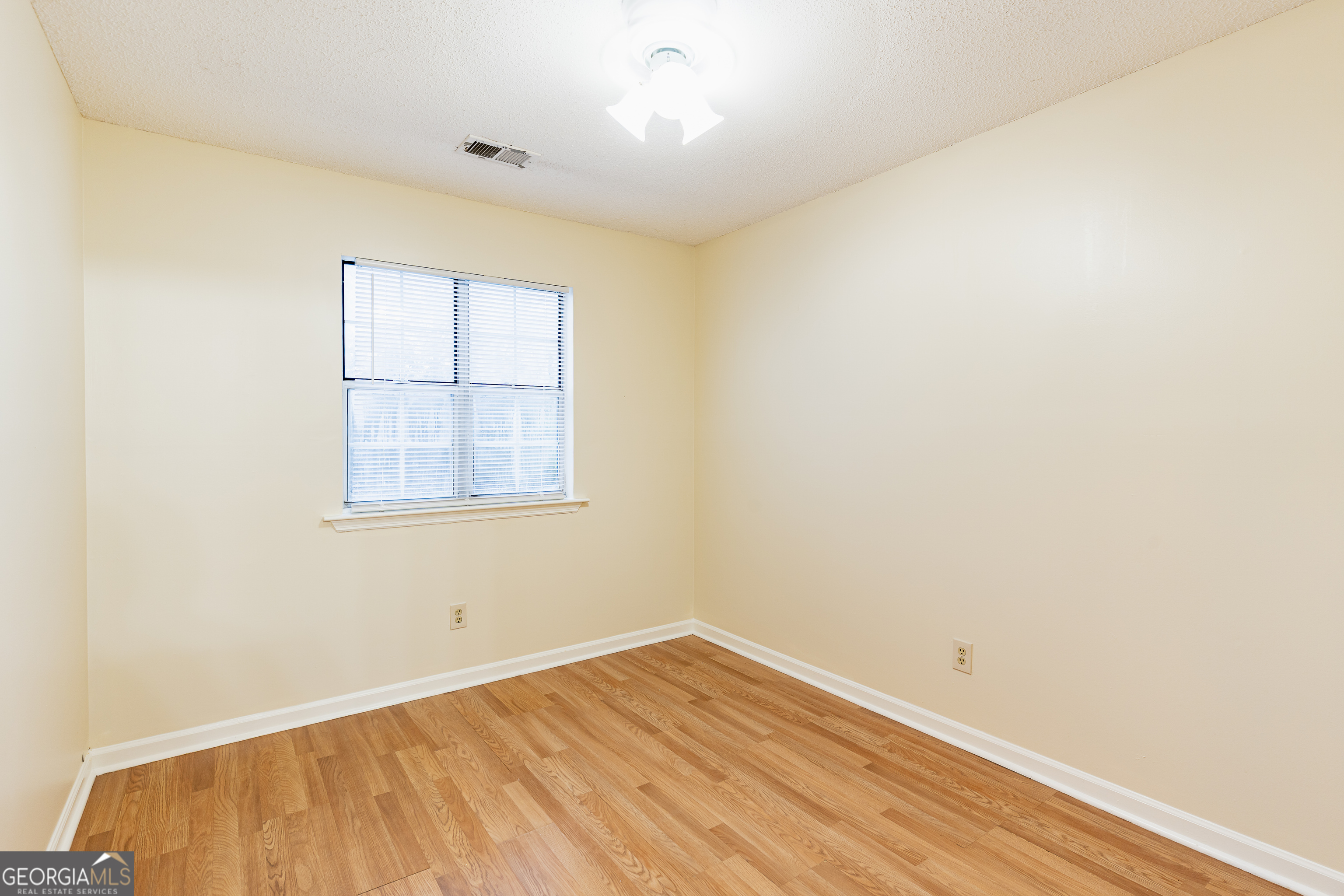 3821 Rex Mill Square Rex, GA 30273 - Photo 21 of 51 an empty room with wooden floor and windows