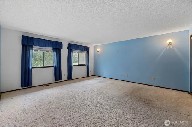 a big room with closet and a bed