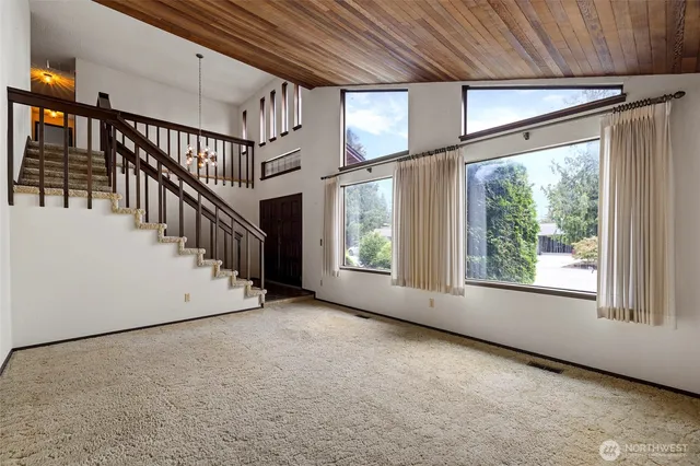 a view of an empty room with stairs