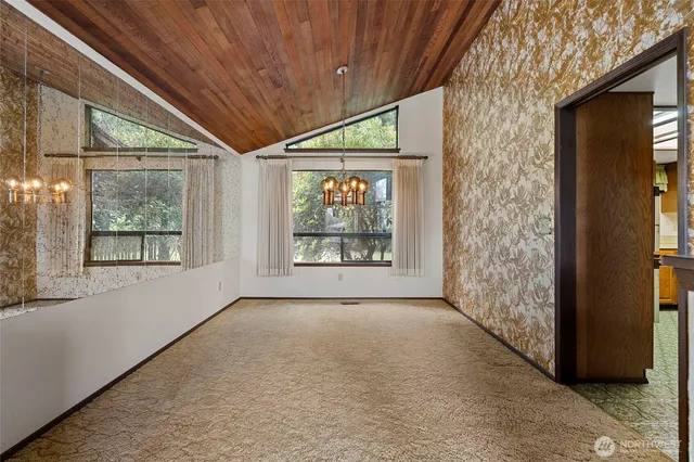 a kitchen with a stove a sink and a refrigerator