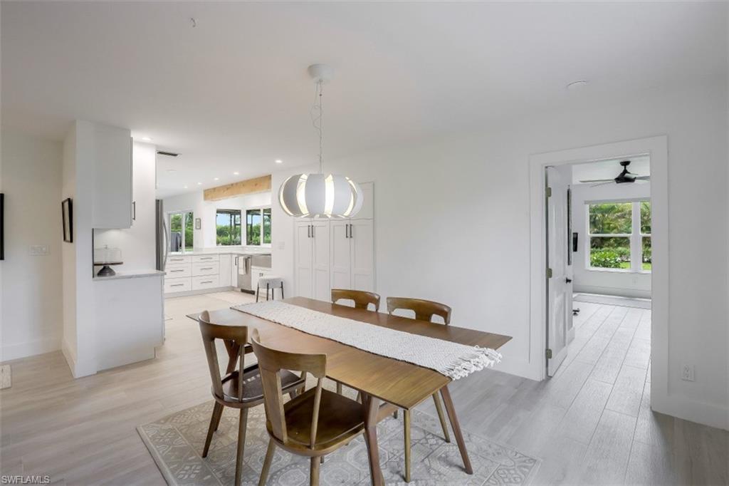 1010 Nottingham Drive Naples, FL 34109 - Photo 11 of 28 a view of a dining room with furniture and window