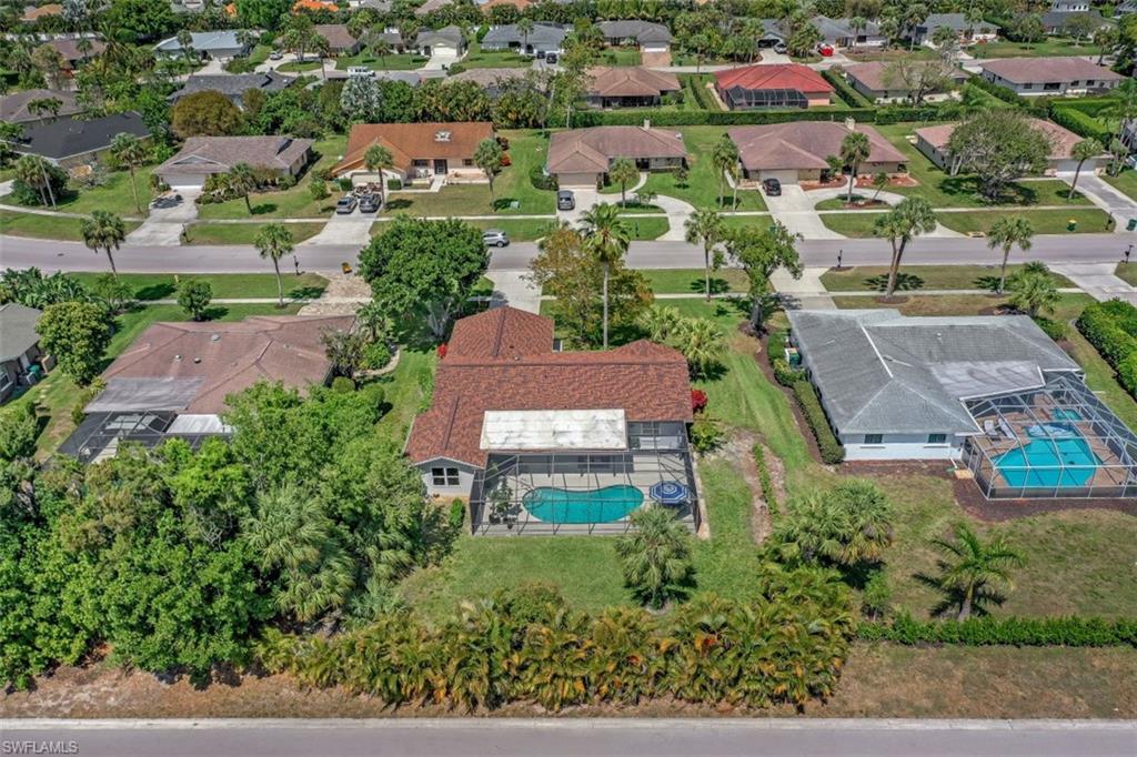 1010 Nottingham Drive Naples, FL 34109 - Photo 24 of 28 an aerial view of residential houses with outdoor space and street view