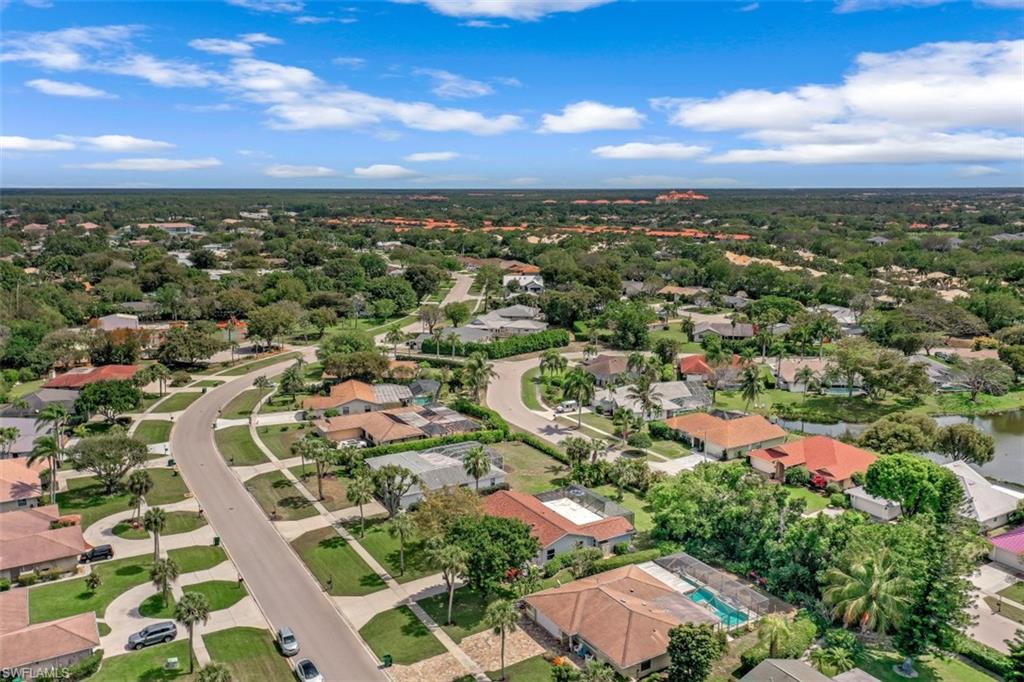 1010 Nottingham Drive Naples, FL 34109 - Photo 27 of 28 an aerial view of residential houses with outdoor space and trees