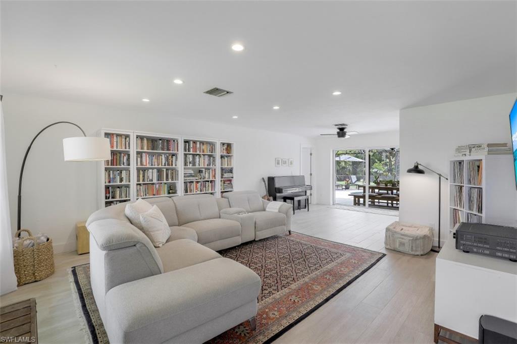 1010 Nottingham Drive Naples, FL 34109 - Photo 4 of 28 a living room with furniture and a large window
