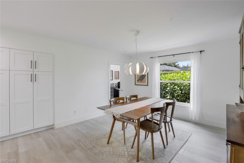 1010 Nottingham Drive Naples, FL 34109 - Photo 10 of 28 a view of a dining room with furniture and window