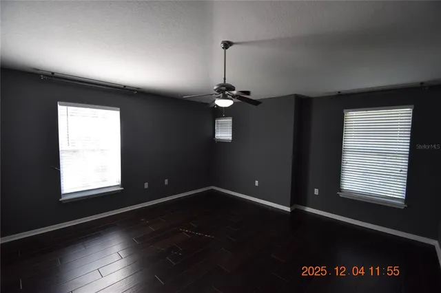 a view of a room with wooden floor and staircase