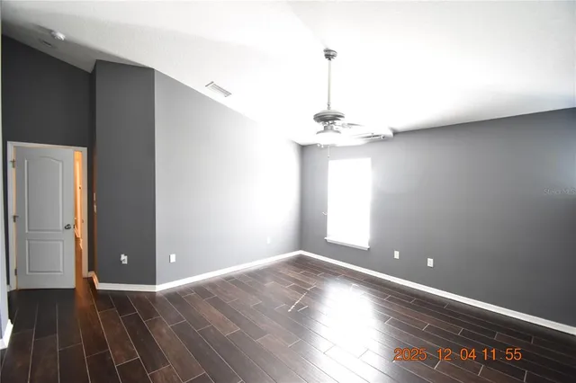 a bathroom with a toilet sink vanity mirror and vanity