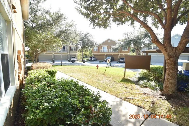 a view of a backyard with a sitting area