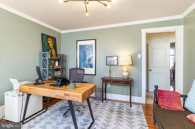 a view of a workspace with furniture