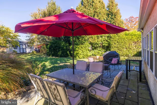 a view of a outdoor sitting area with an umbrella