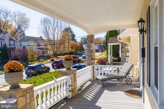 a view of a chair and tables in the balcony