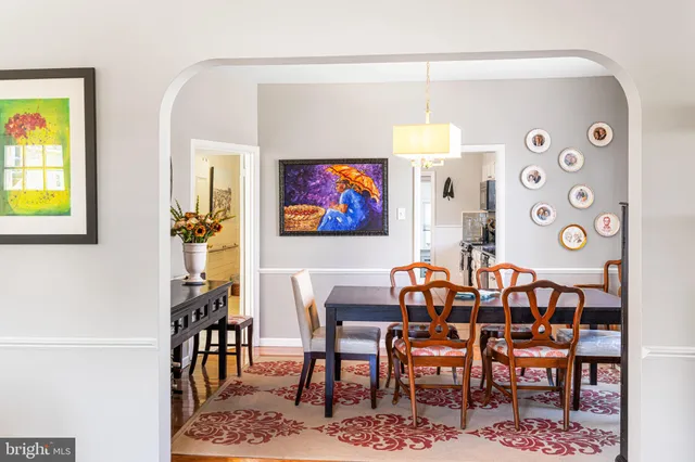 a view of a dining room with furniture and a rug