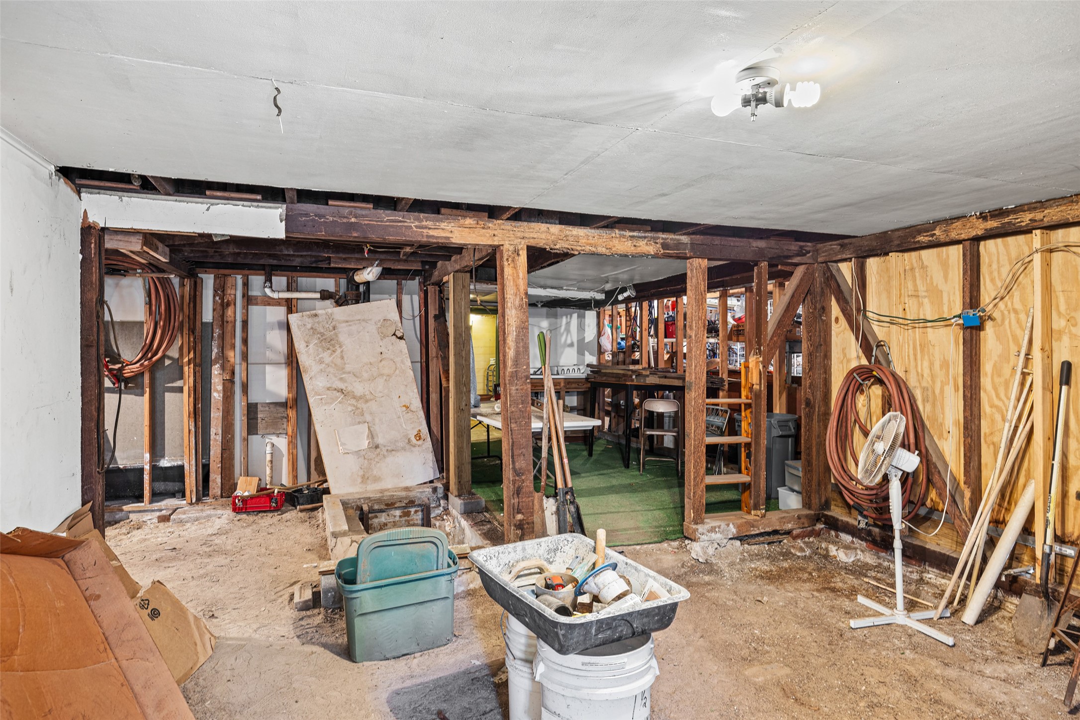 1214 Edwards Street Houston, TX 77007 - Photo 27 of 34 This photo shows a basement. The space has potential for customization, possibly for storage or a workshop.