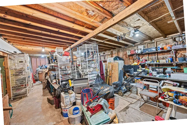 an aerial view of a house with a yard basket ball court and outdoor seating