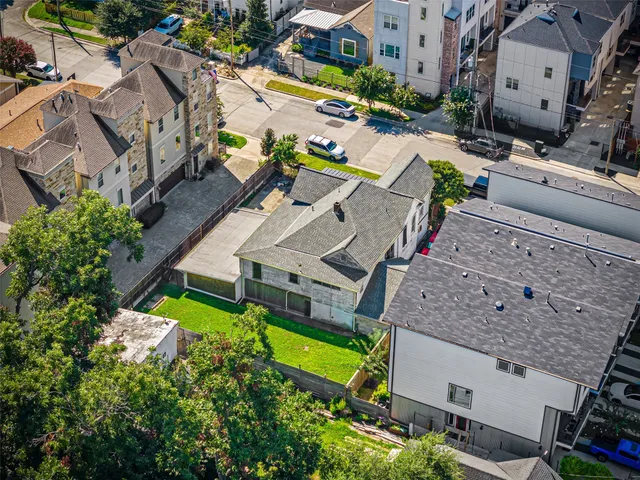 an aerial view of a house with a garden