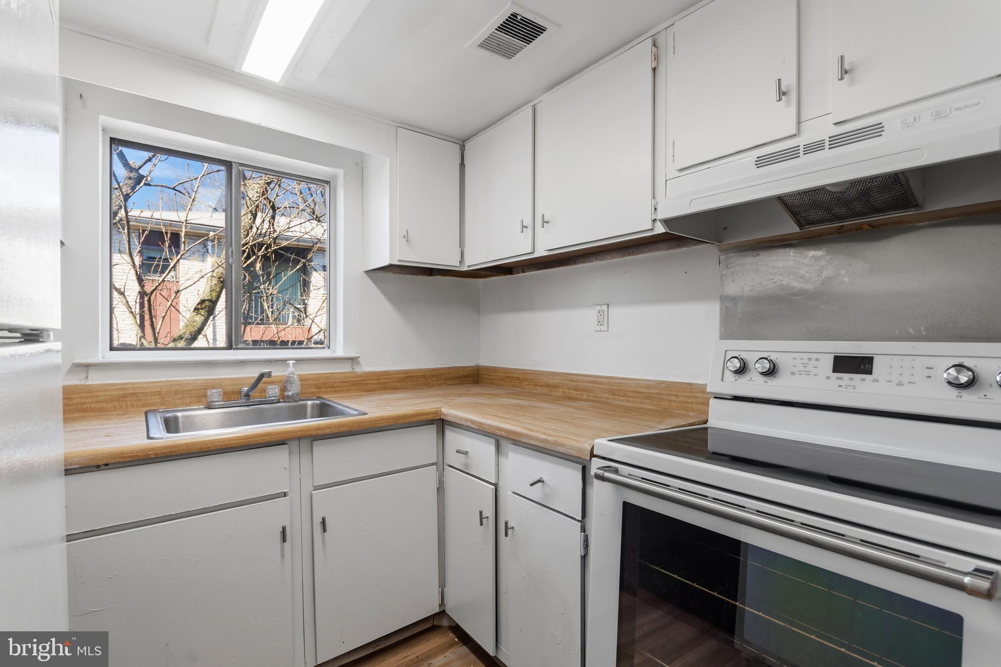 8030 Ditman Street, Unit 40G Philadelphia, PA 19136 - Photo 7 of 16 a kitchen with a sink and cabinets