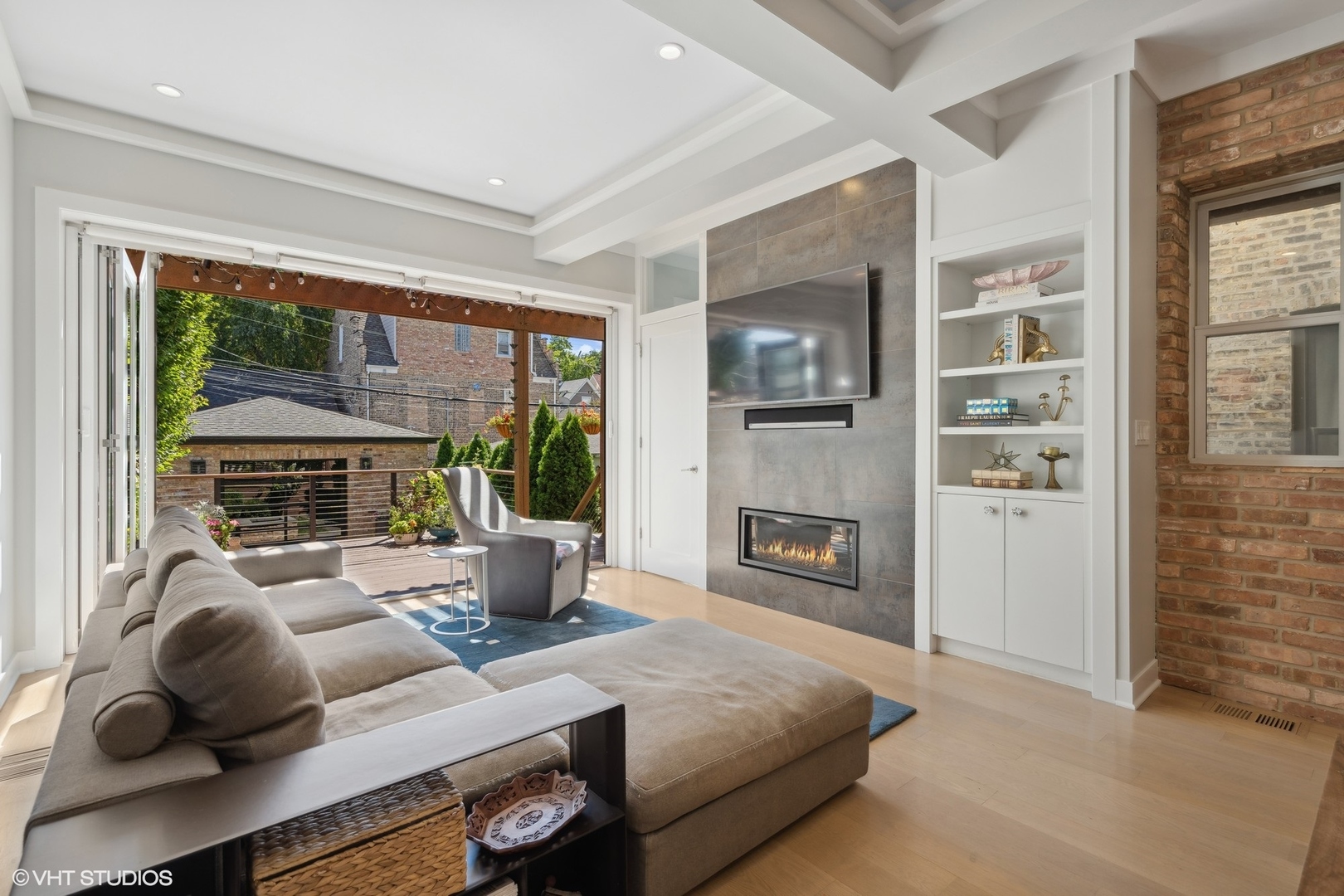 1925 West Grace Street Chicago, IL 60613 - Photo 12 of 45 a living room with furniture and a fireplace