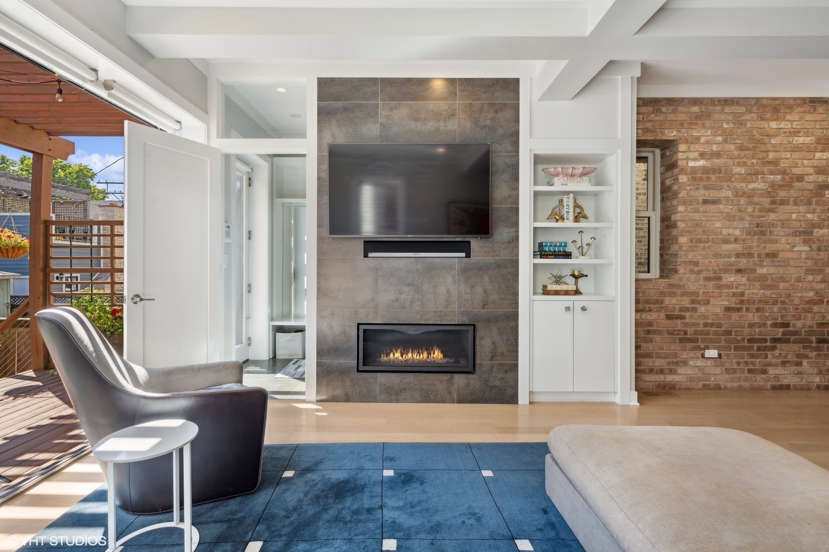 1925 West Grace Street Chicago, IL 60613 - Photo 14 of 45 a living room with furniture and a fireplace