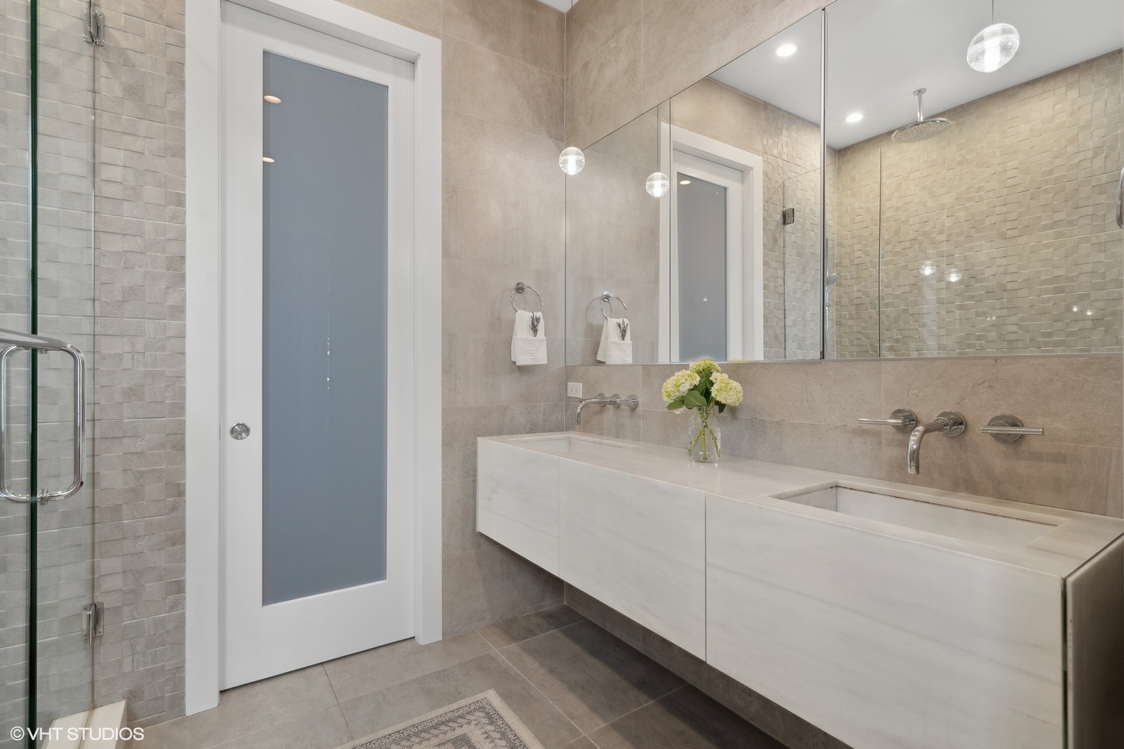 1925 West Grace Street Chicago, IL 60613 - Photo 20 of 45 a bathroom with a double vanity sink mirror and shower