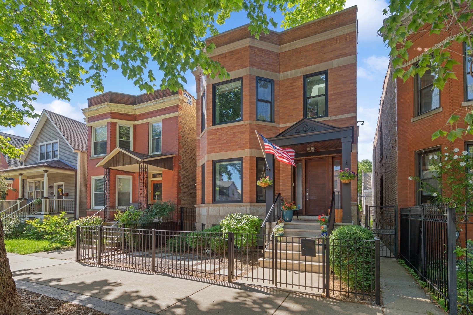 1925 West Grace Street Chicago, IL 60613 - Photo 2 of 45 front view of a brick house with a small yard