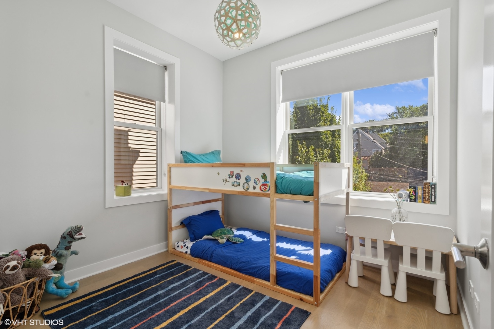 1925 West Grace Street Chicago, IL 60613 - Photo 24 of 45 a living room with a bed furniture and a window