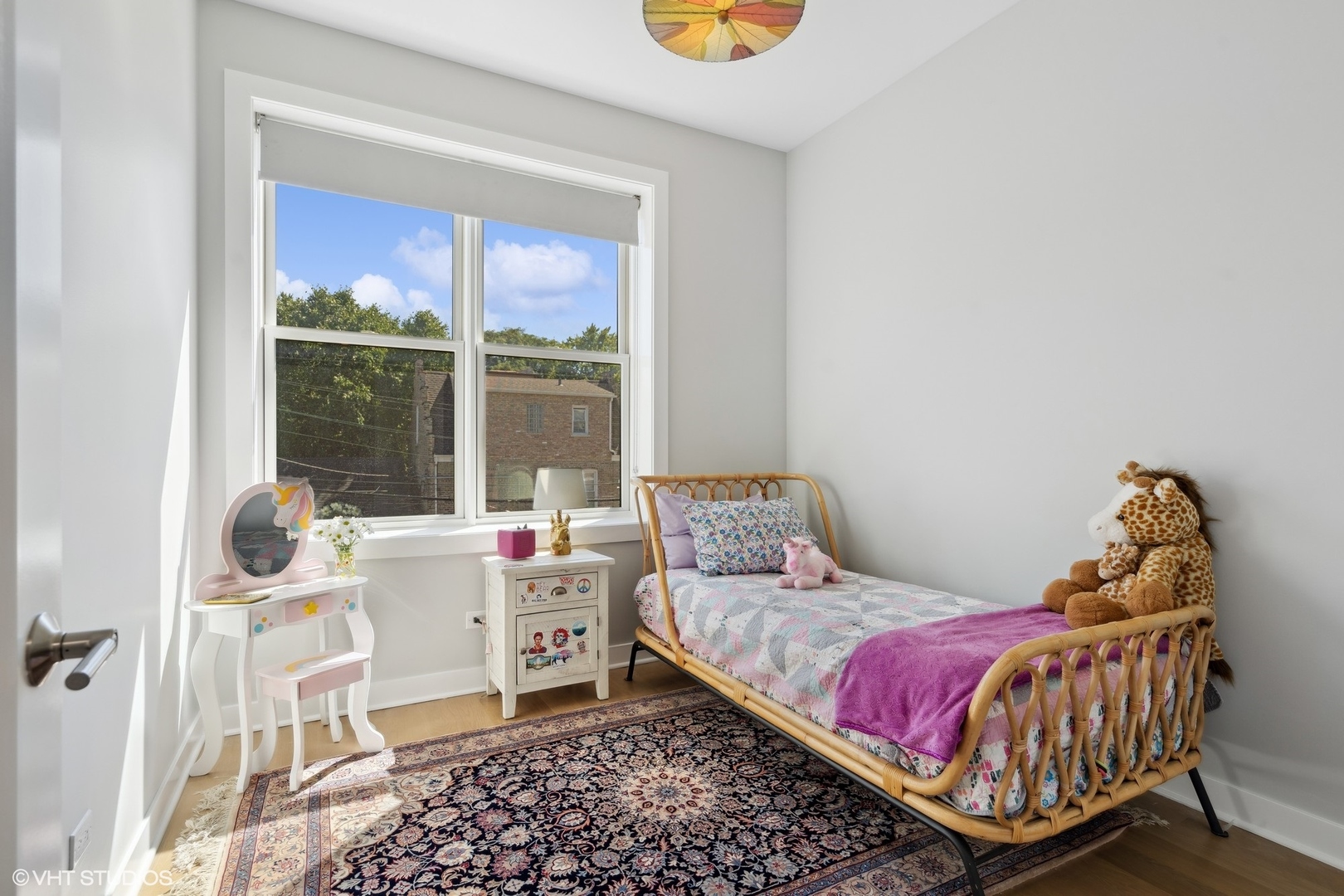1925 West Grace Street Chicago, IL 60613 - Photo 26 of 45 a living room with a bed and a window