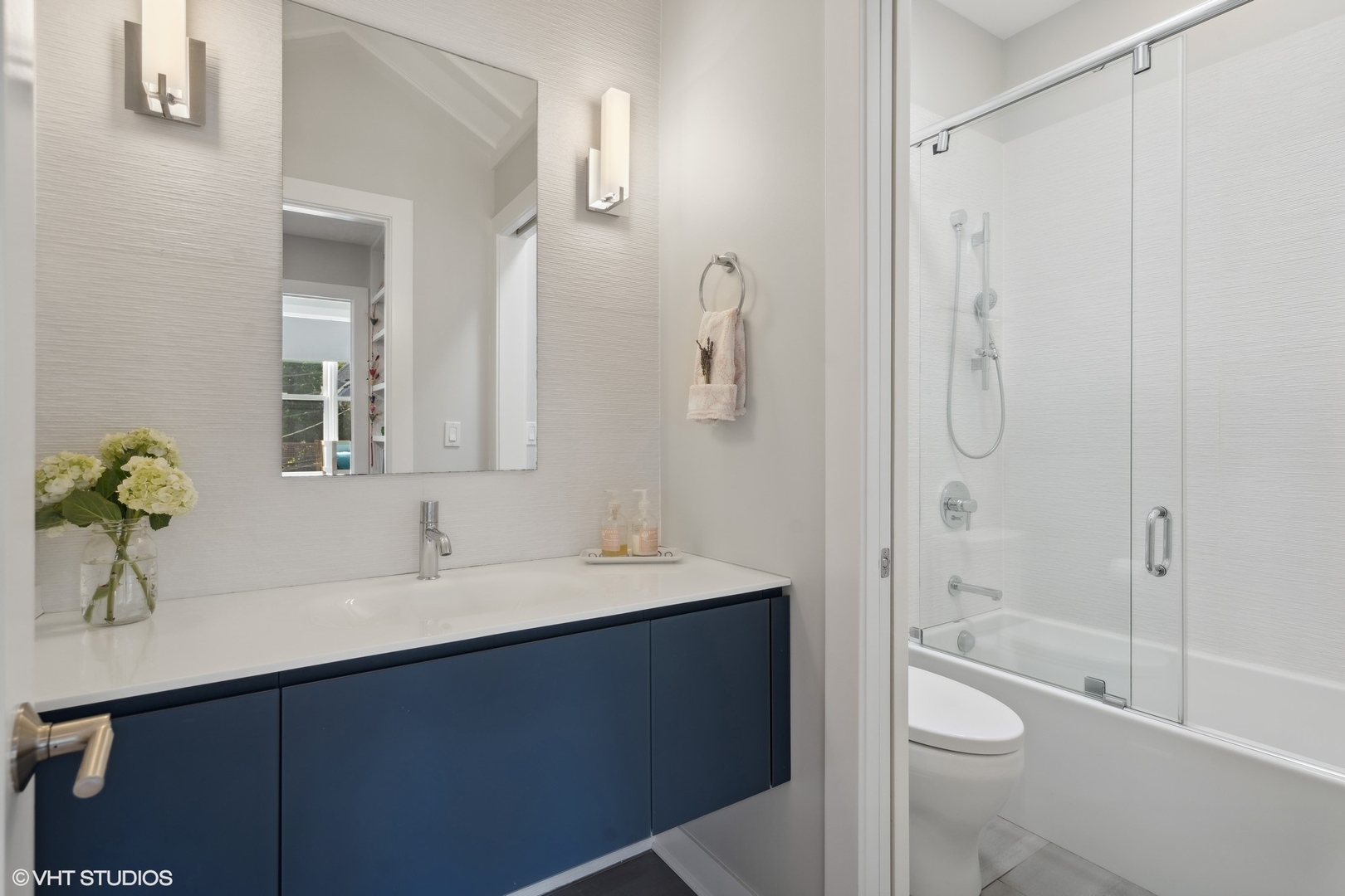 1925 West Grace Street Chicago, IL 60613 - Photo 27 of 45 a bathroom with a bathtub shower sink and toilet