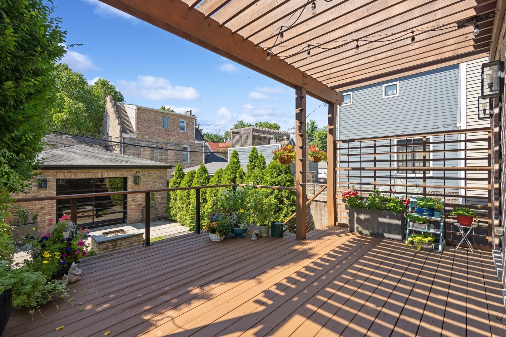 1925 West Grace Street Chicago, IL 60613 - Photo 38 of 45 a view of a chairs and table on the wooden deck