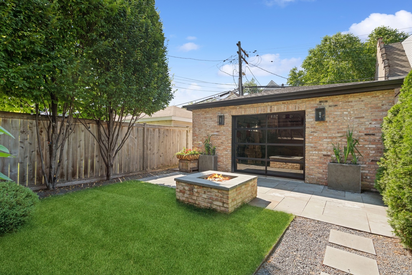 1925 West Grace Street Chicago, IL 60613 - Photo 42 of 45 a backyard of a house with yard and trampoline
