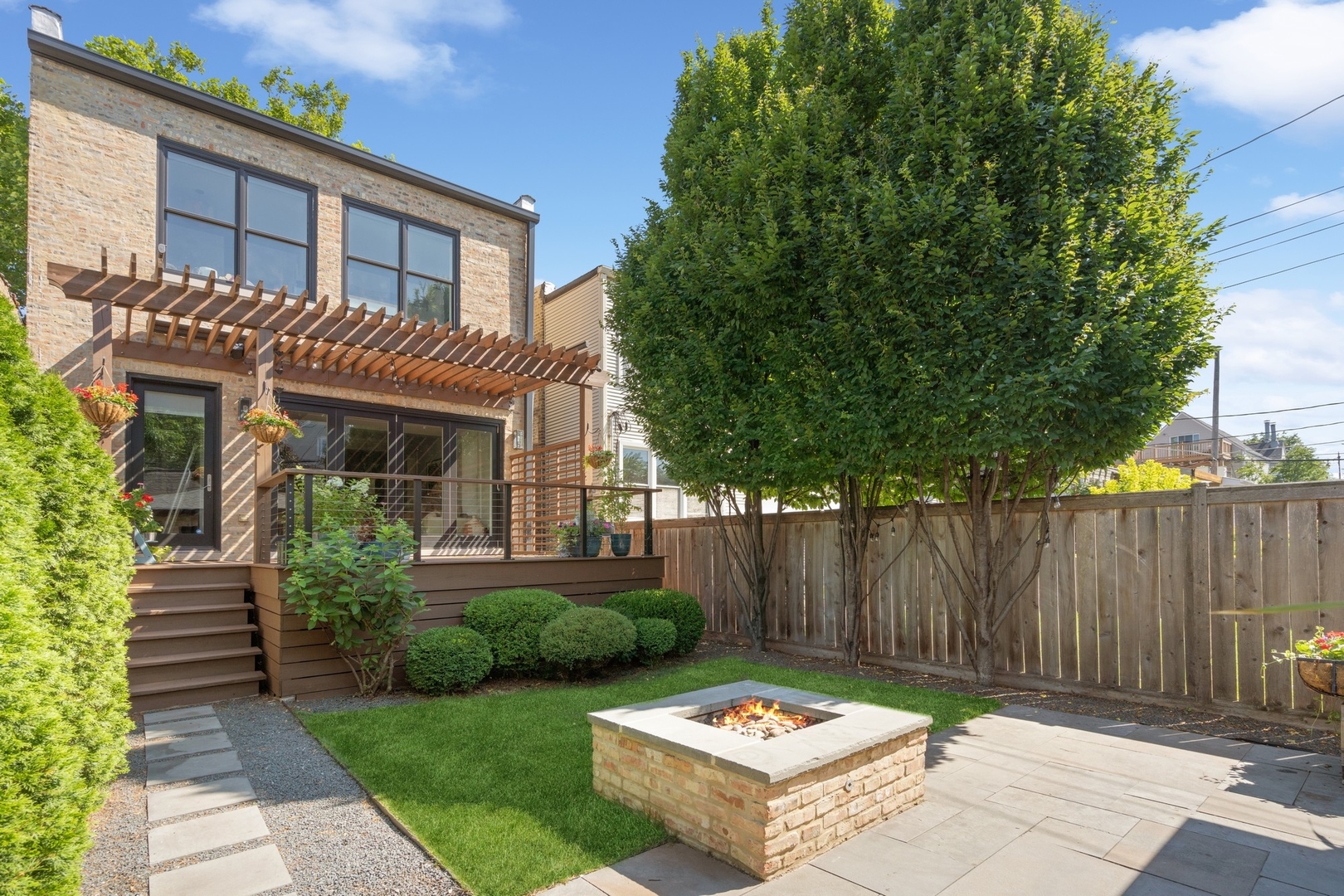1925 West Grace Street Chicago, IL 60613 - Photo 43 of 45 a backyard of a house with yard and outdoor seating
