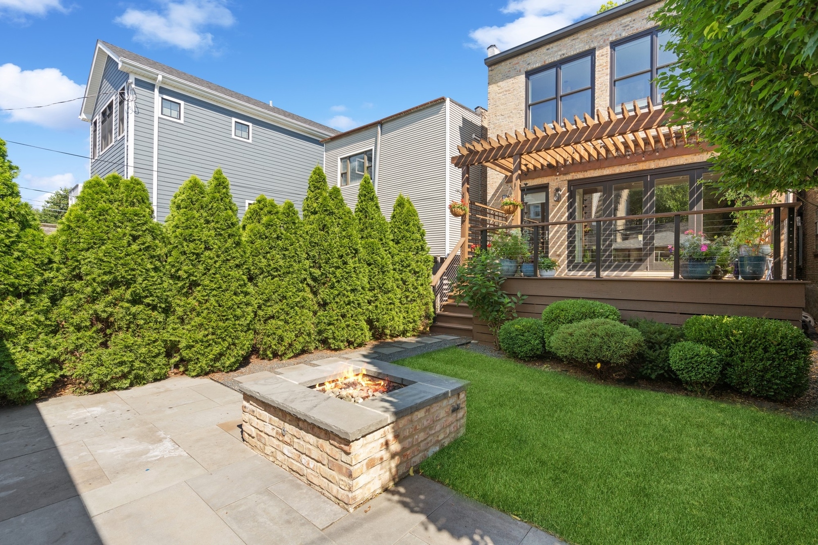 1925 West Grace Street Chicago, IL 60613 - Photo 44 of 45 a front view of a house with a yard