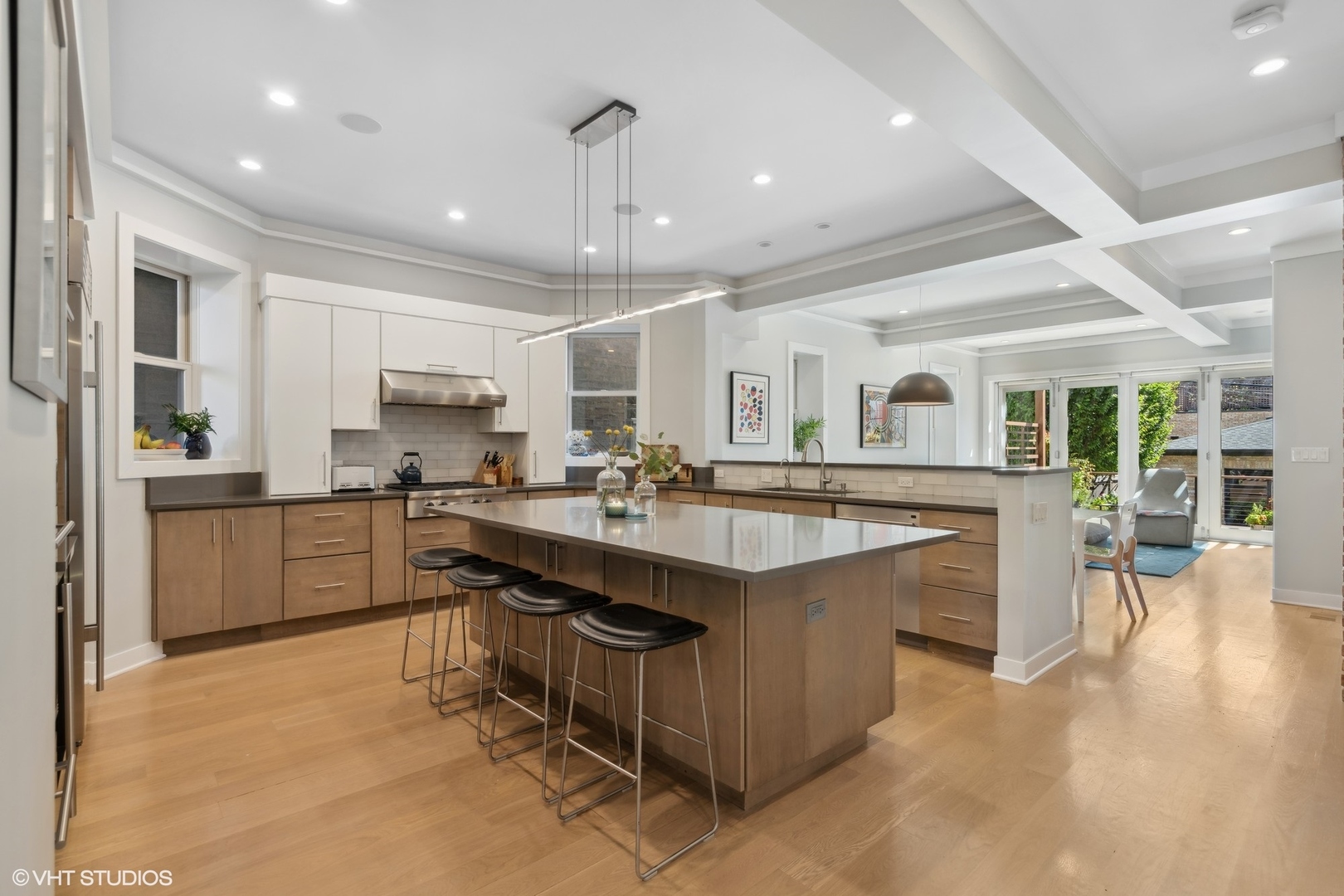1925 West Grace Street Chicago, IL 60613 - Photo 5 of 45 a large kitchen with kitchen island lots of counter space a sink and appliances