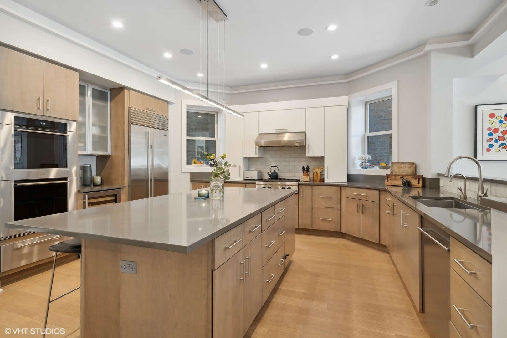 1925 West Grace Street Chicago, IL 60613 - Photo 6 of 45 a large kitchen with stainless steel appliances a sink and cabinets