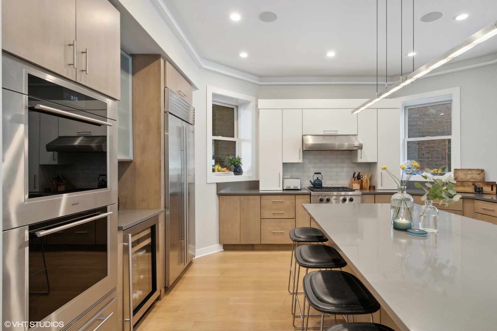 1925 West Grace Street Chicago, IL 60613 - Photo 7 of 45 a kitchen with a sink stainless steel appliances and cabinets