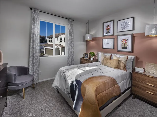 a bedroom with bed and a window