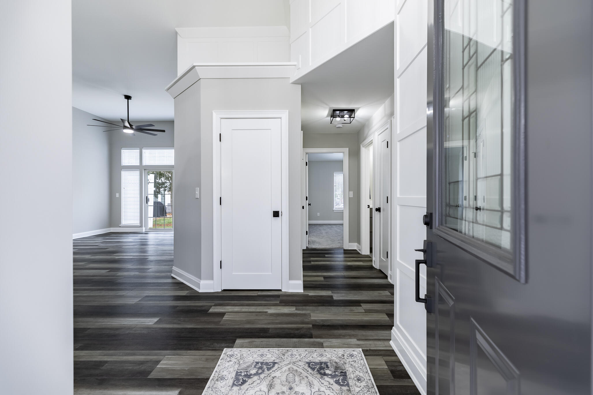 1607 Geranium Circle Valparaiso, IN 46383 - Photo 13 of 30 a view of a hallway with wooden floor and staircase
