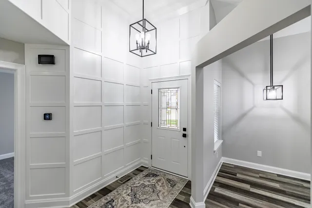 a kitchen with kitchen island a counter top space a sink and stainless steel appliances