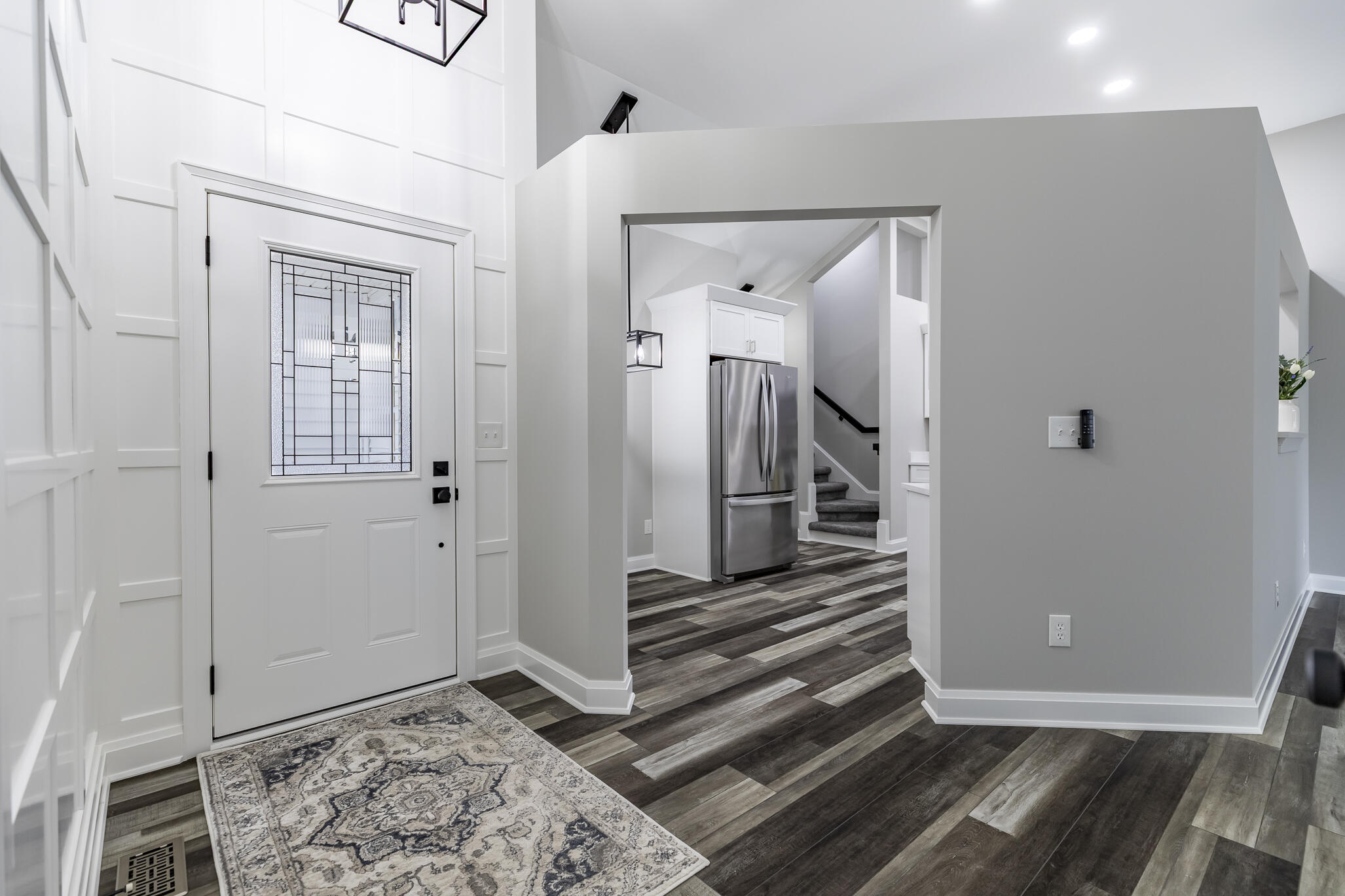 1607 Geranium Circle Valparaiso, IN 46383 - Photo 15 of 30 a view of a hallway with entryway wooden floor and stairs