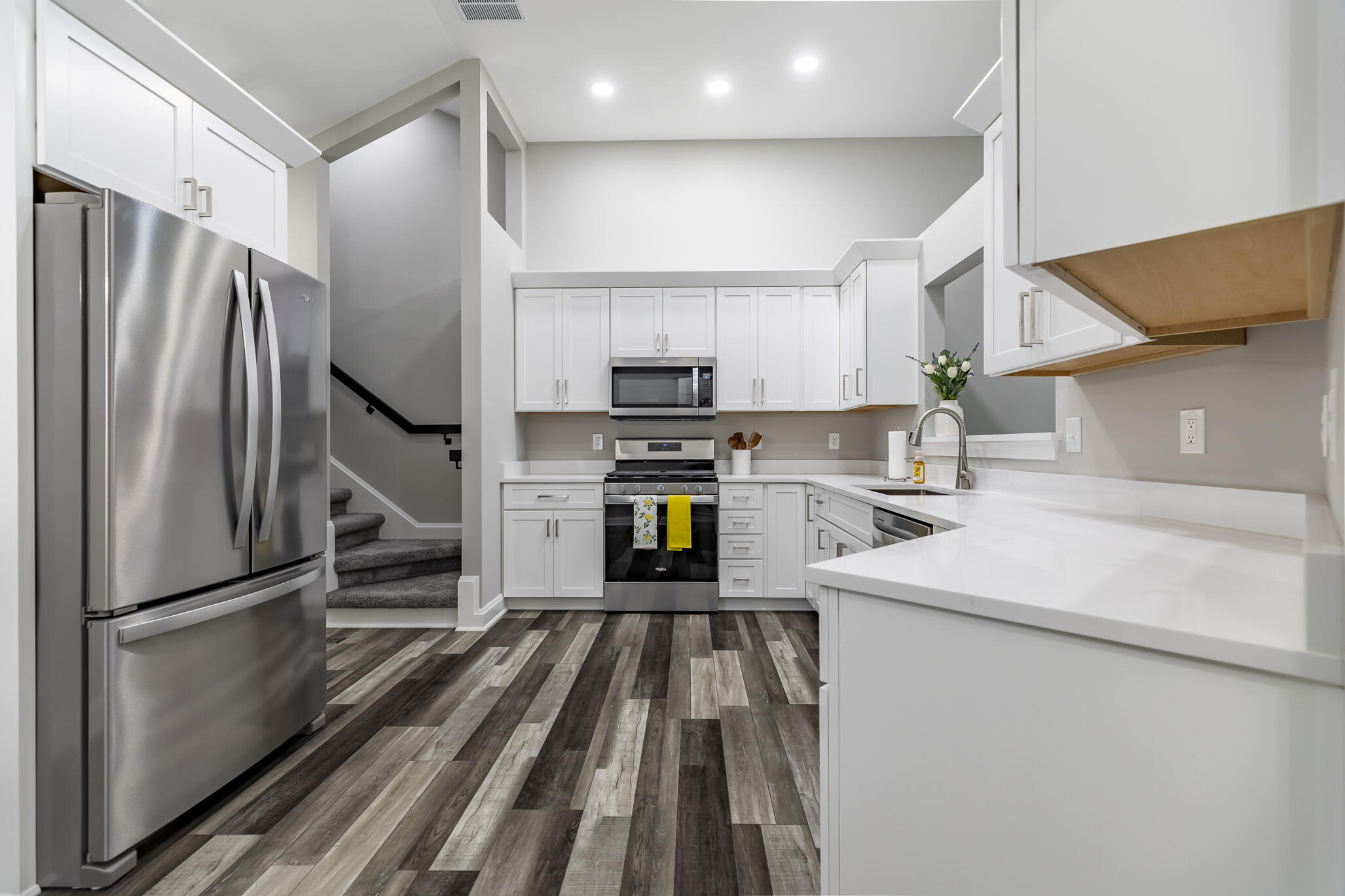 1607 Geranium Circle Valparaiso, IN 46383 - Photo 17 of 30 a kitchen with kitchen island a counter top space a sink and stainless steel appliances