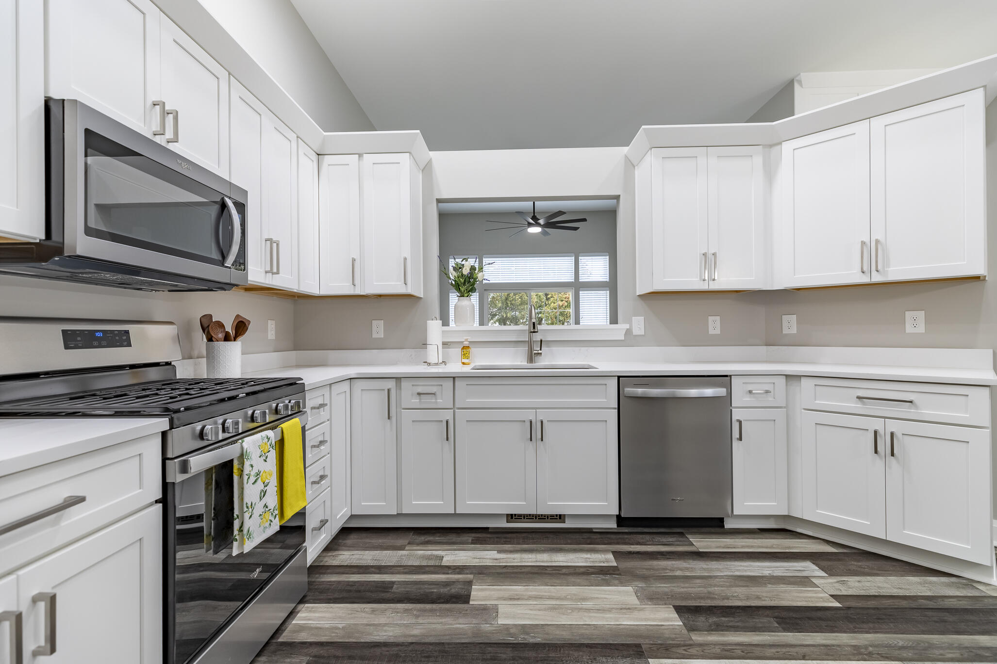 1607 Geranium Circle Valparaiso, IN 46383 - Photo 18 of 30 a kitchen with stainless steel appliances granite countertop a stove a sink and a microwave