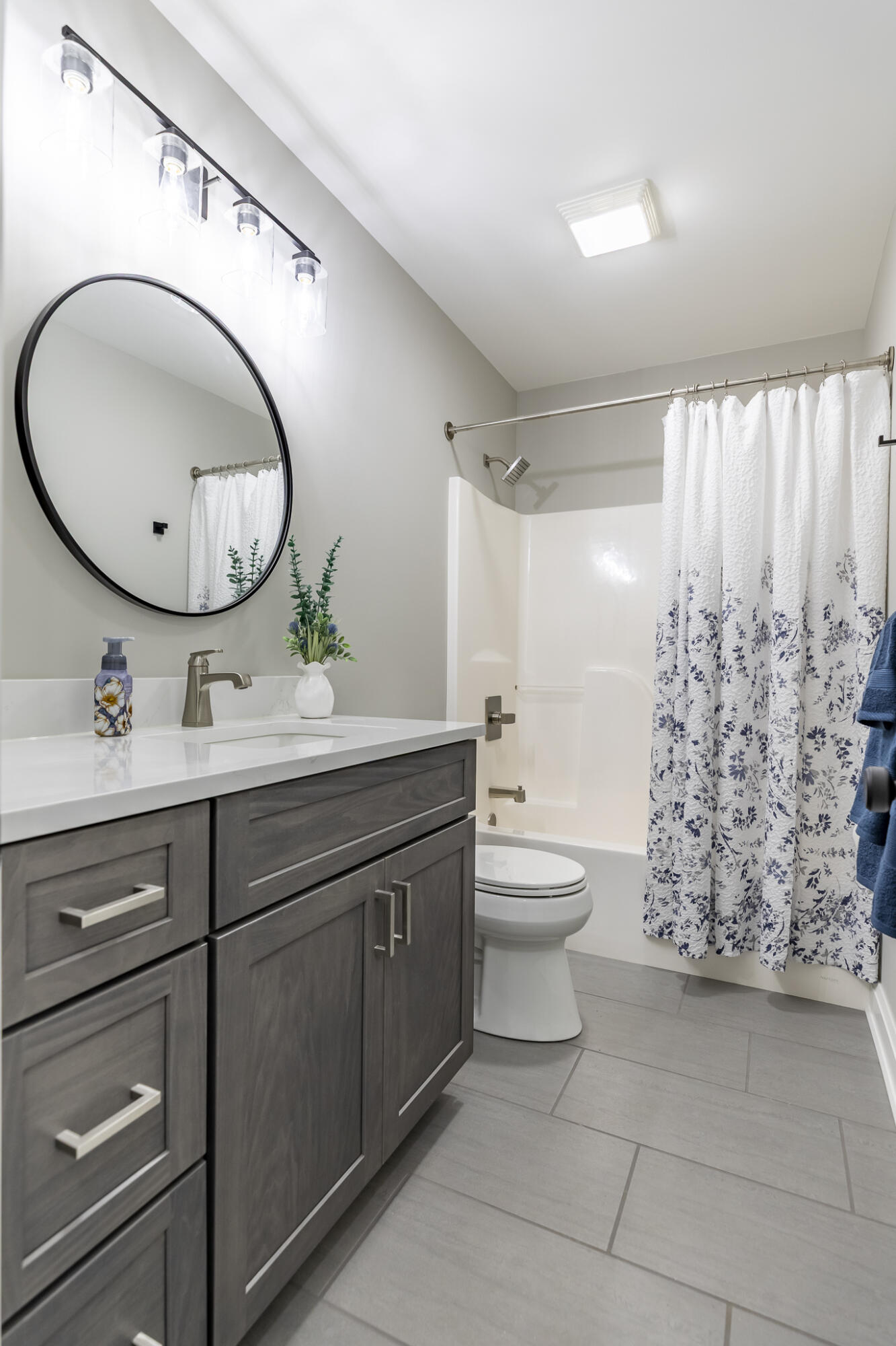 1607 Geranium Circle Valparaiso, IN 46383 - Photo 24 of 30 a bathroom with a double vanity sink mirror and toilet