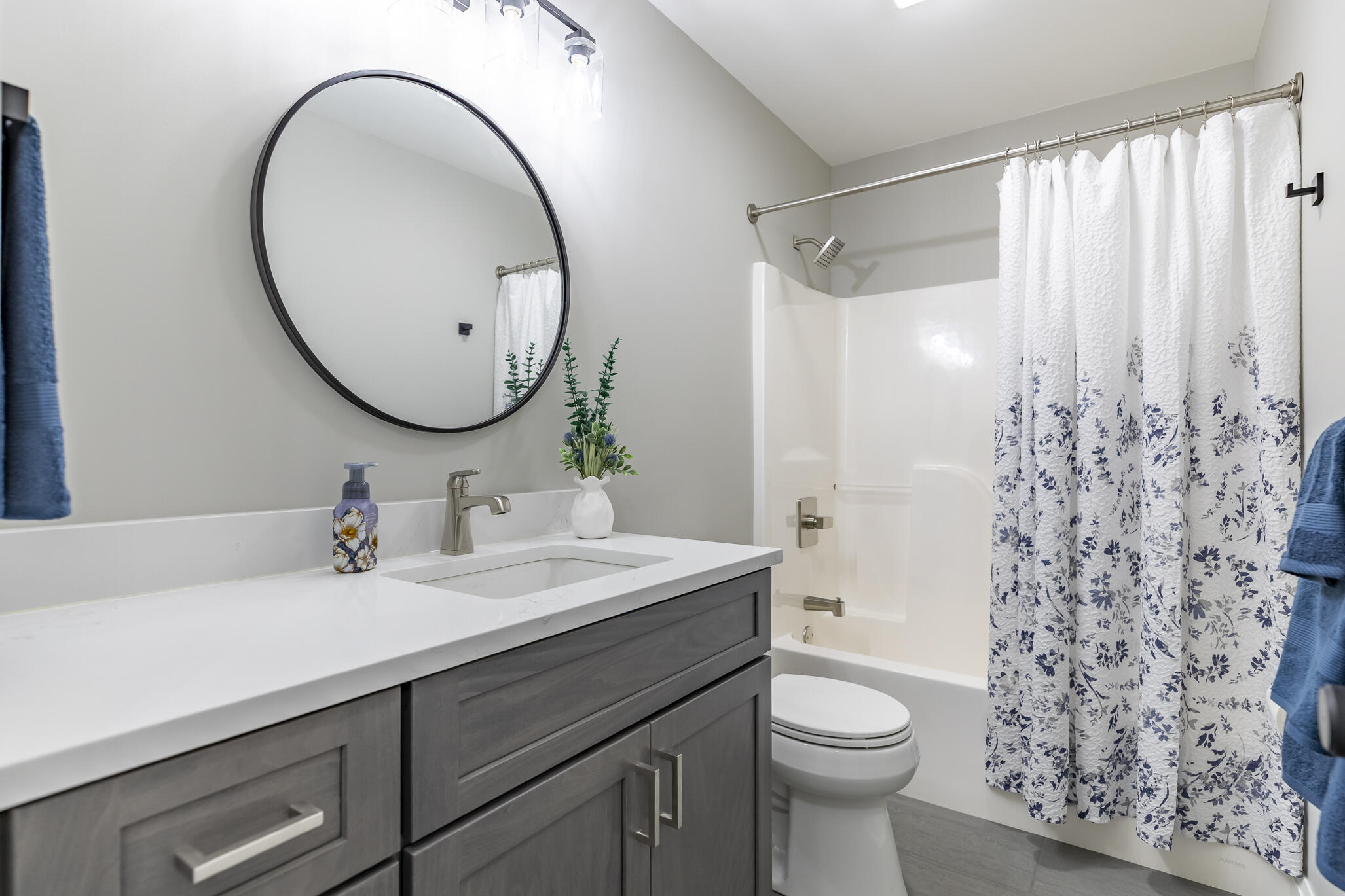 1607 Geranium Circle Valparaiso, IN 46383 - Photo 25 of 30 a bathroom with a sink a toilet and a mirror