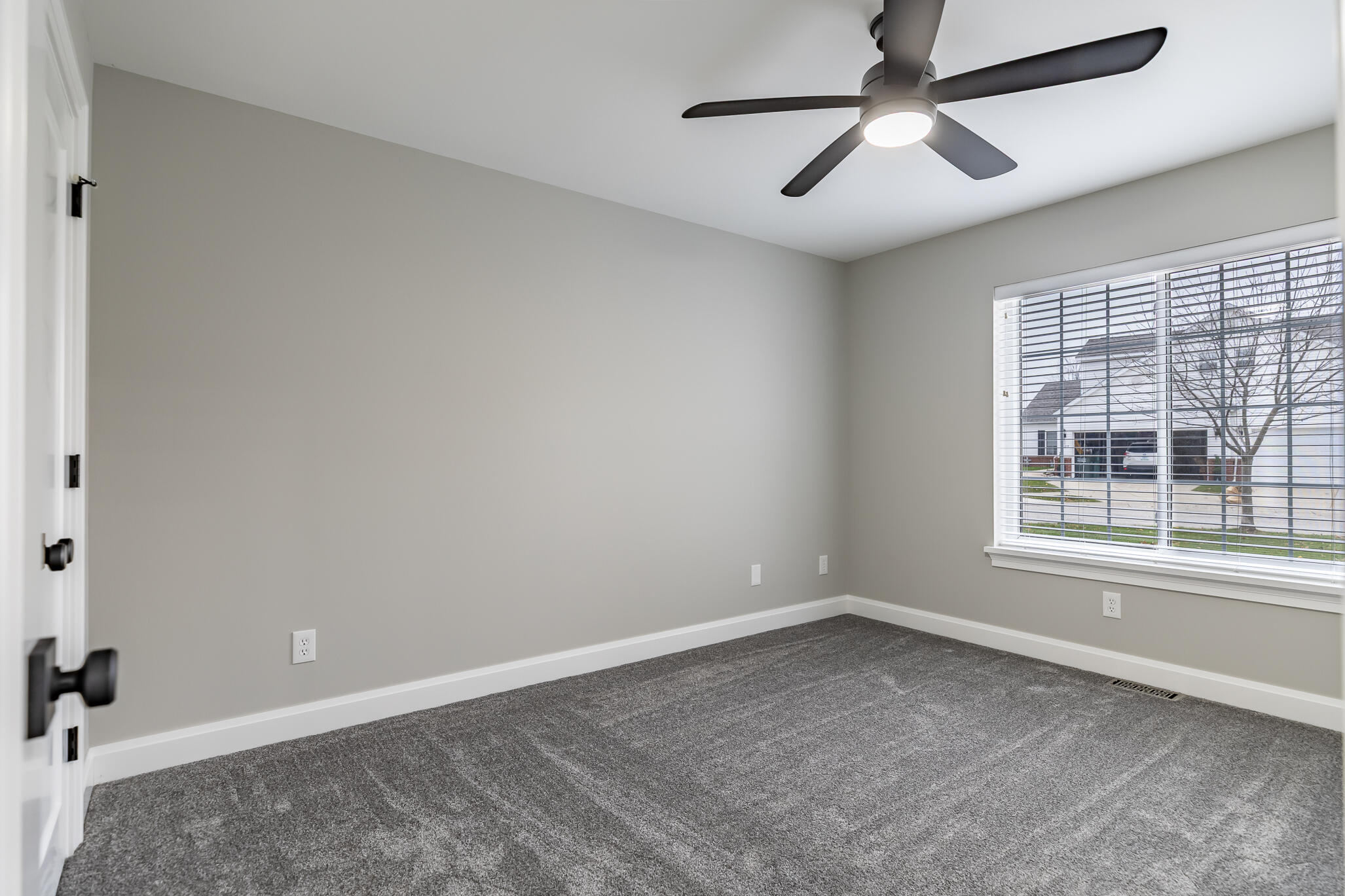 1607 Geranium Circle Valparaiso, IN 46383 - Photo 28 of 30 an empty room with ceiling fan and windows