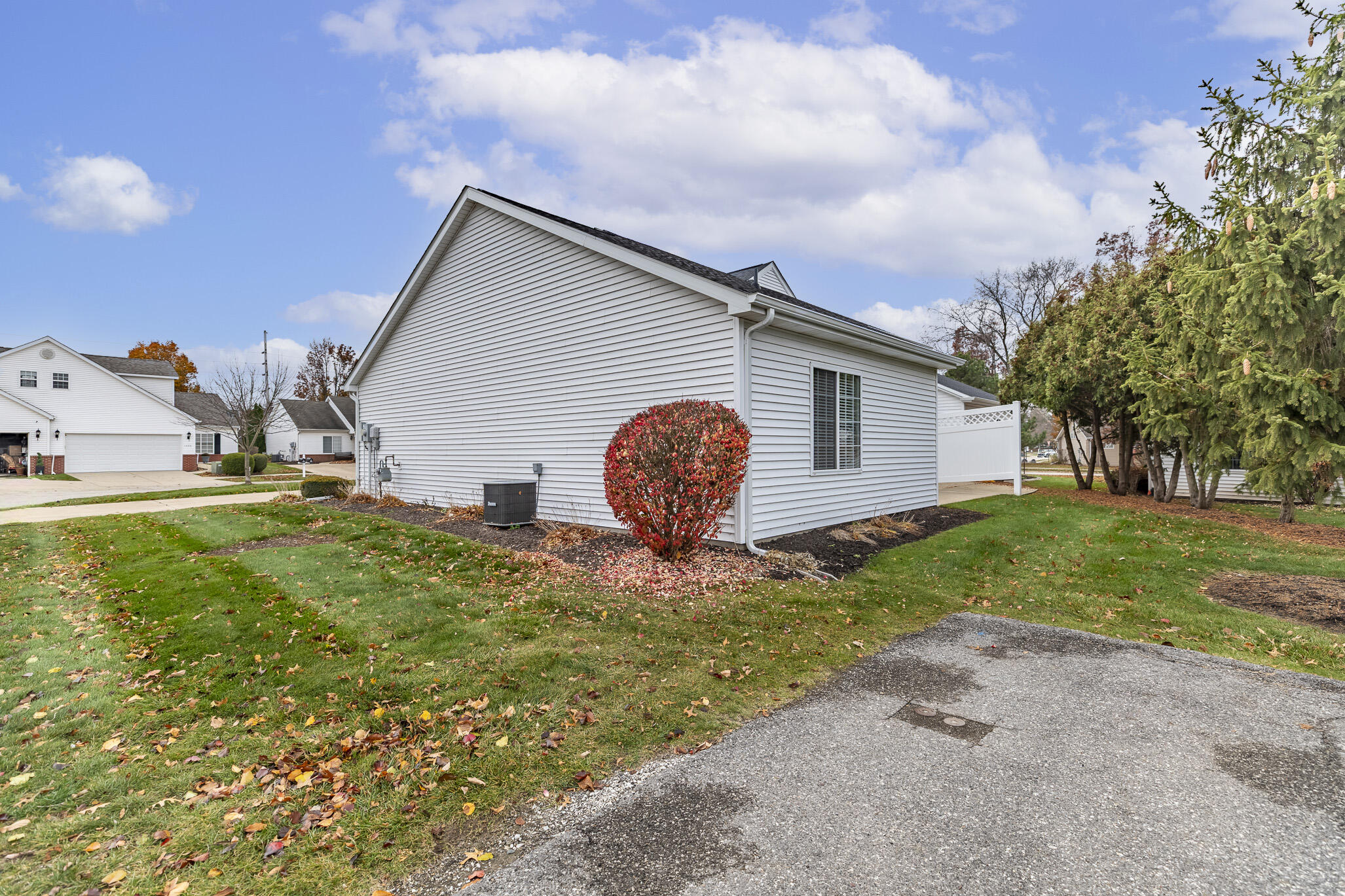1607 Geranium Circle Valparaiso, IN 46383 - Photo 4 of 30 a view of a backyard with plants and a large tree