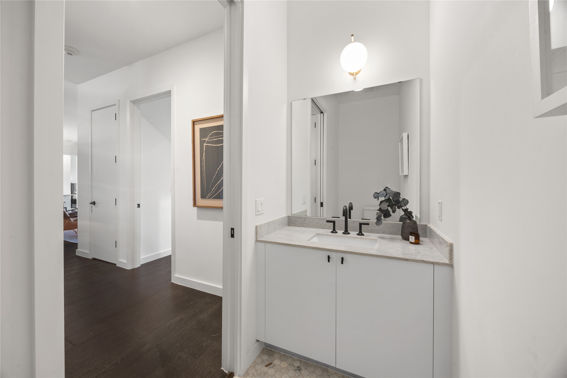 800 Embassy Drive, Unit 602 Austin, TX 78702 - Photo 15 of 37 Vanity area featuring a stone countertop, integrated sink, and matte black faucet